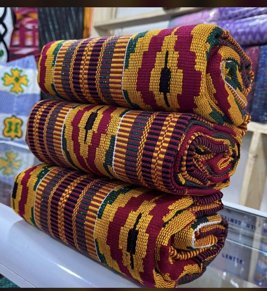 Wine and gold kente cloth rolled