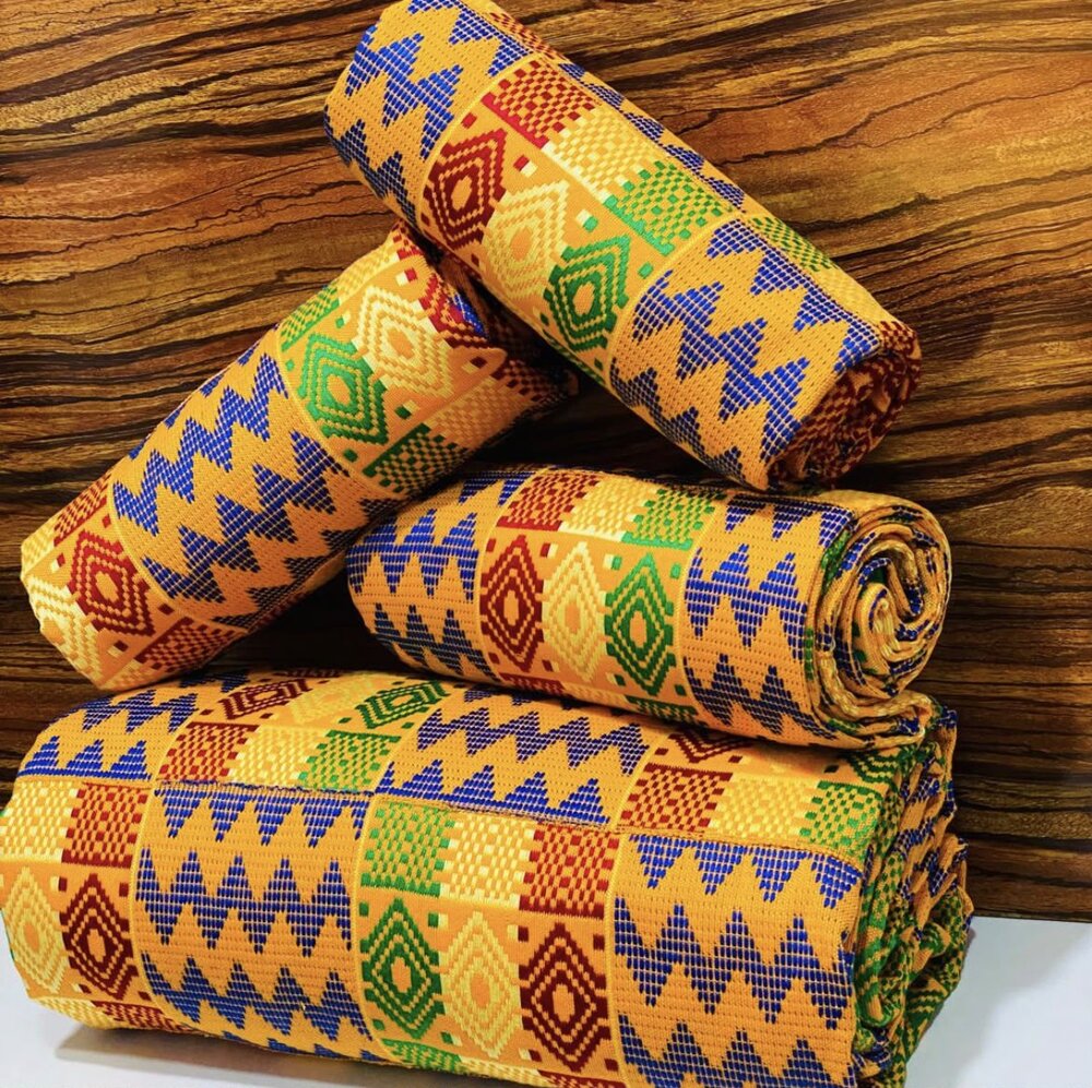 Stacked rolls of handwoven kente cloth